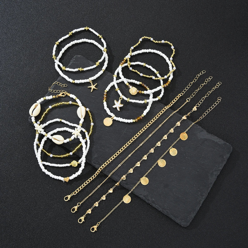 SHELLA - 
14Pcs/Set Bohemian Rice Beads Starfish Shell Anklet Sets for Women Retro Gold Color Multilayer Foot Chain Vacation Jewelry Gifts