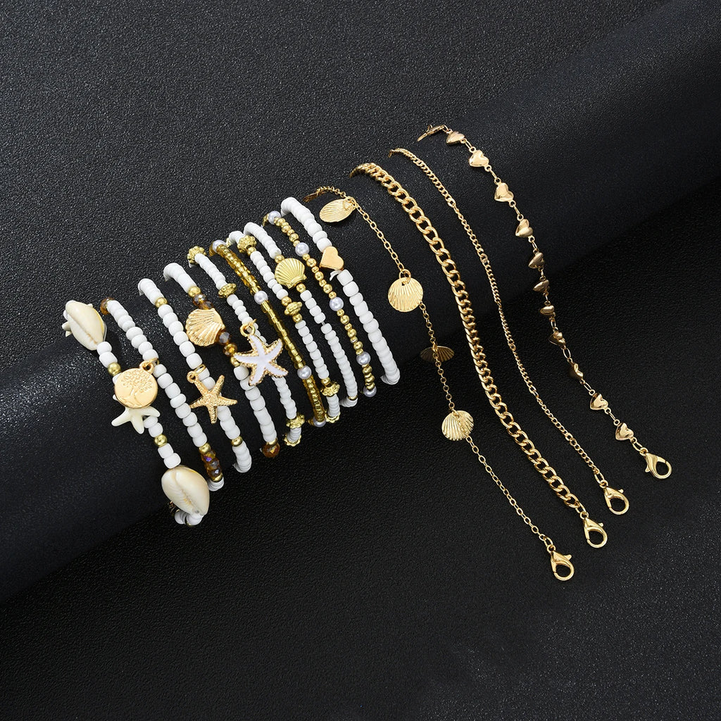 SHELLA - 
14Pcs/Set Bohemian Rice Beads Starfish Shell Anklet Sets for Women Retro Gold Color Multilayer Foot Chain Vacation Jewelry Gifts